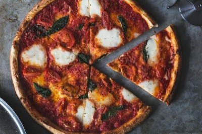 first-slice-of-fresh-margarita-pizza